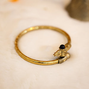 Gold-plated Trishul Damroo Karungali Kada with intricate detailing of Trishul, Damroo, and Karungali beads, inspired by Lord Shiva's symbolism.