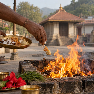 Ganahoma: coconut, jaggery and modakas offered into a Ganahoma fire