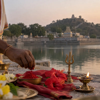 Kumkumarchana: kumkum, hibiscus and a trishul on a red cloth