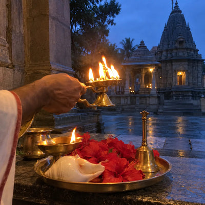 Multi-wick aarti lamp, conch and bell at the pre-dawn mangala aarti