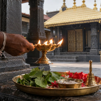 Nataraja Archana: a multi-wick aarti lamp over bilva leaves and flowers
