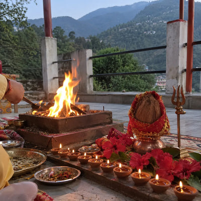Havan fire with nine diyas, red hibiscus and a trishul