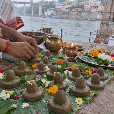 Small hand-made clay Shivlings on a banana leaf for Partheshwar puja