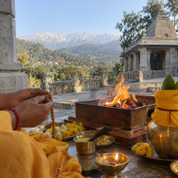 Turmeric mala being counted beside a havan kund and a yellow kalash
