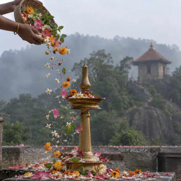 Pushpabhishekam: flowers showered over a brass lamp for pushpabhishekam