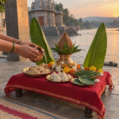 Kalash with a coconut, banana leaves, sheera and modaks for Satyavinayak puja