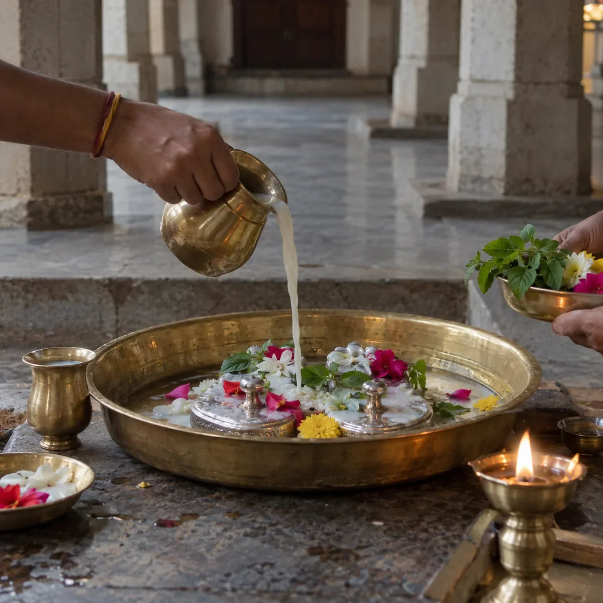 Paduka Abhishekam: milk abhishekam on silver padukas