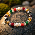 Navratan bracelet on a textured stone surface