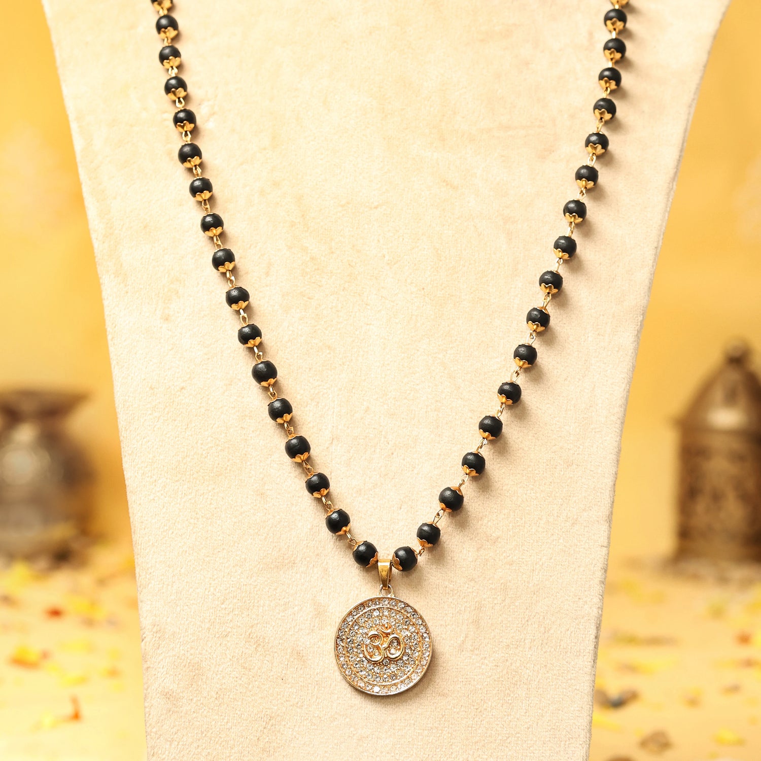 Divine Karungali Malai with Gold Capped Beads & Om Pendant