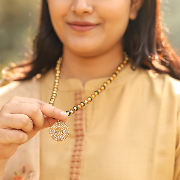 Rudraksha Karungali Malai in Gold-Cap with Om Pendant Lifestyle Female