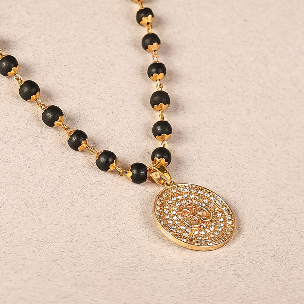 Divine Karungali Malai with Gold Capped Beads & Om Pendant Closeup