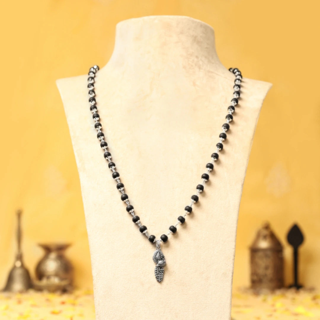Silver Cap Karungali Mala with Vel Peacock Pendant