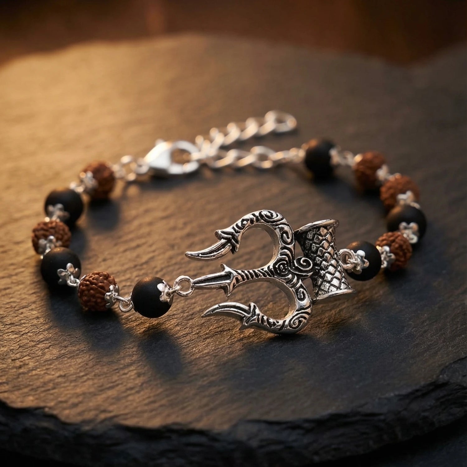 Silver cap Rudraksha karungali Bracelet With Trishul Damroo
