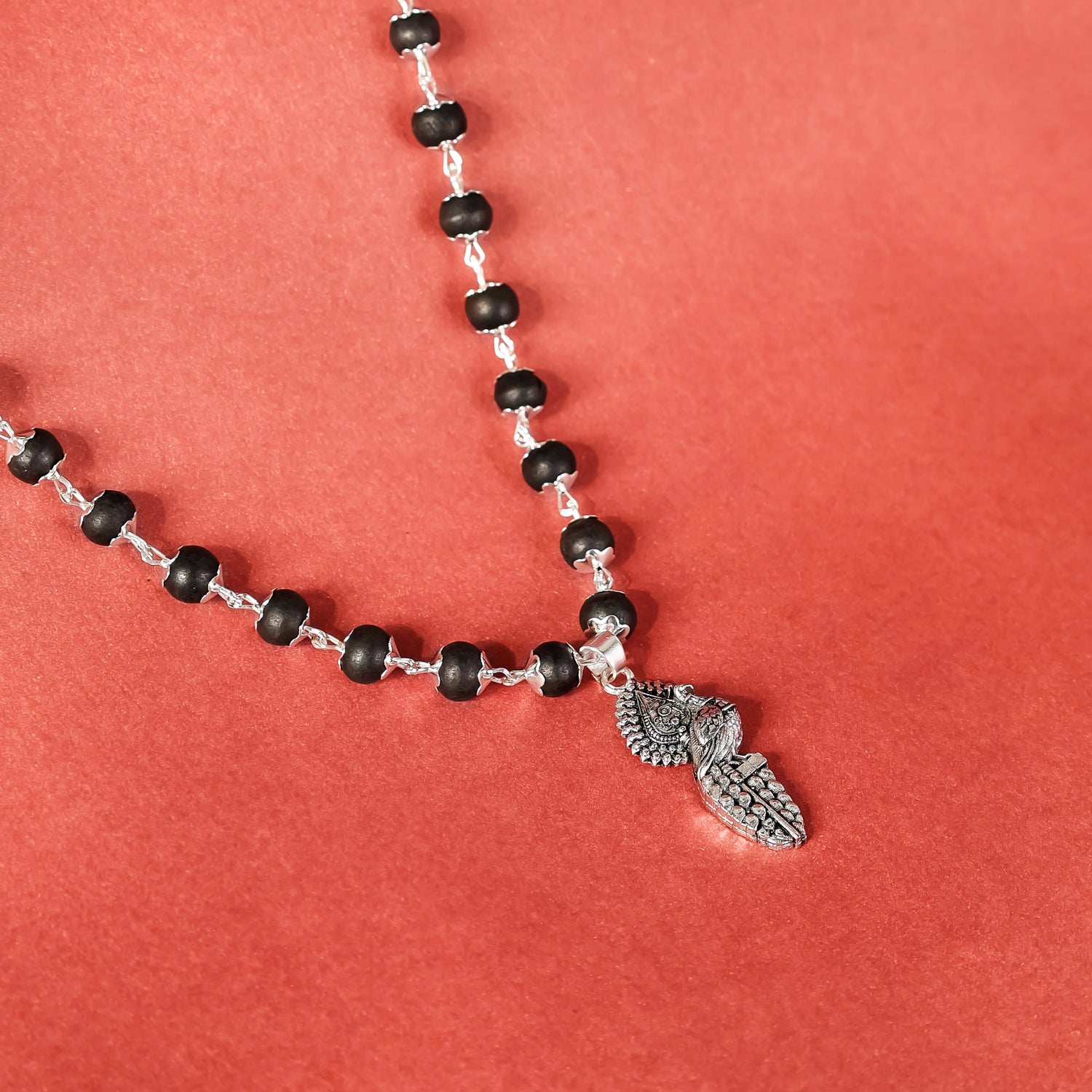 Silver Cap Karungali Mala with Vel Peacock Pendant