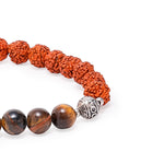 Spiritual Harmony Bracelet - Tiger's Eye, Rudraksha, and Buddha Symbol Closeup