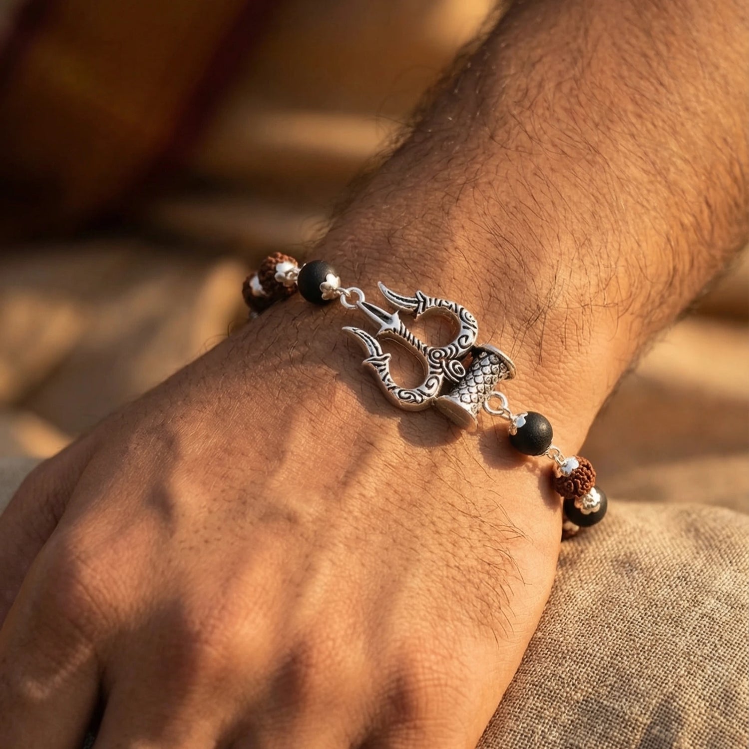 Silver cap Rudraksha karungali Bracelet With Trishul Damroo