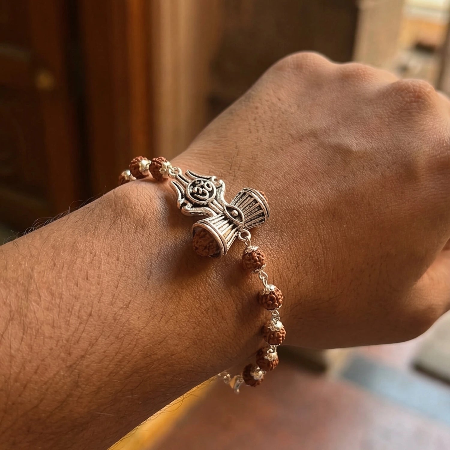 Silver Cap Rudraksha Bracelet with Trishul Damroo