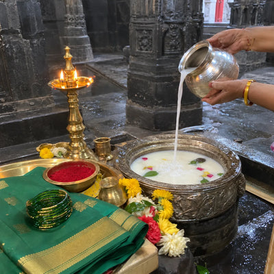 Silver kalash, kunku, a green saree and bangles for abhishek mahapuja