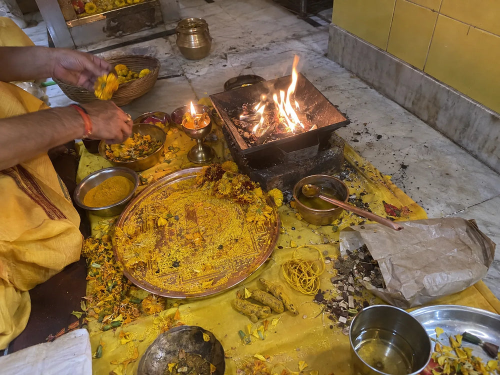 Maa Baglamukhi Puja: havan for Maa Baglamukhi with turmeric and yellow offerings on a yellow cloth