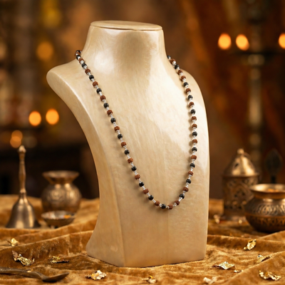 Sterling silver Karungali and Rudraksha malai on a display bust