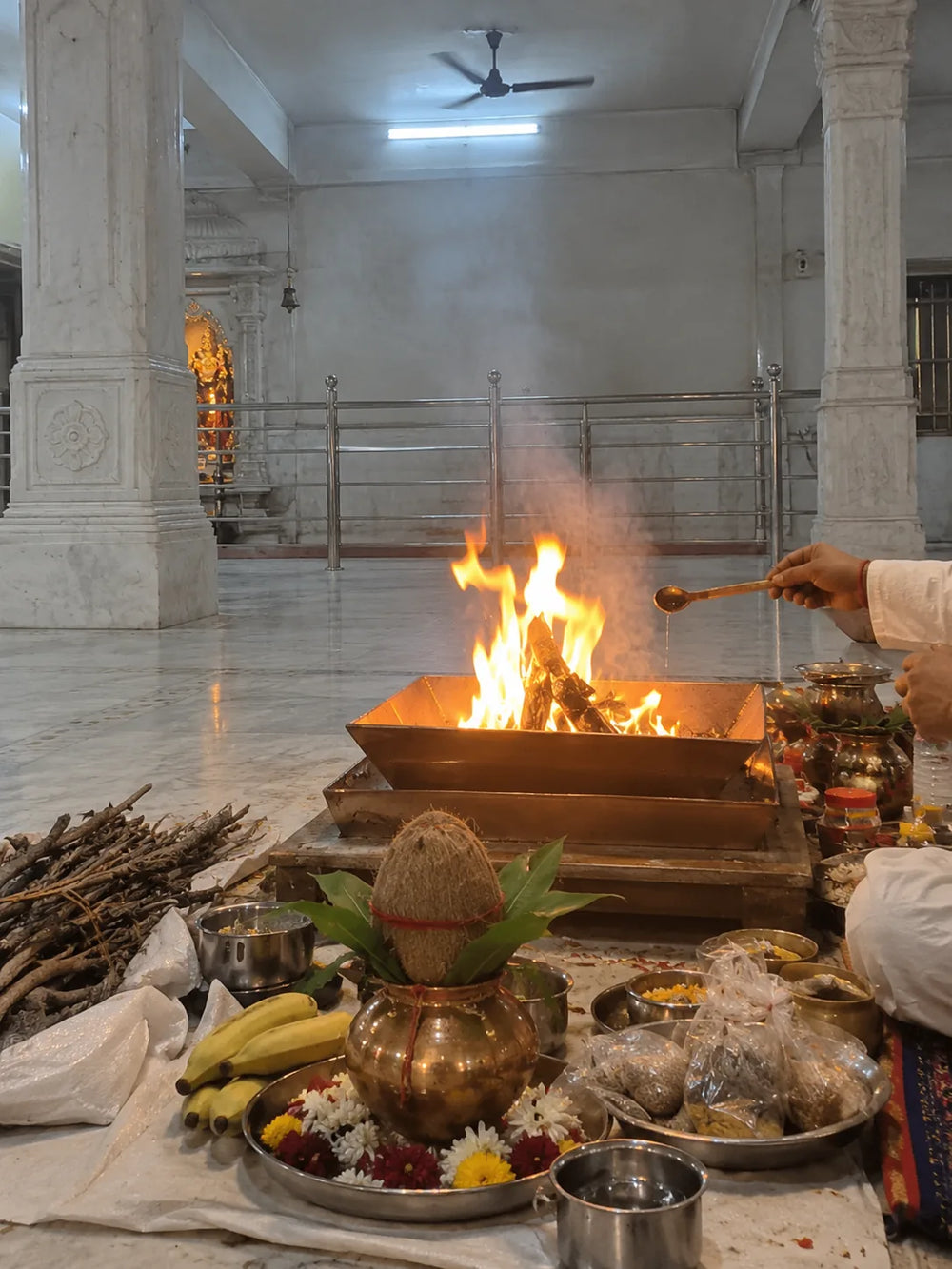 Kaal Sarp Dosh Nivaran Puja: the havan fire with a kalash, coconut and offerings