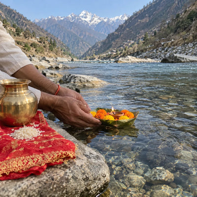 A leaf boat with marigolds and a lit diya on mountain water, Himalayan peaks behind