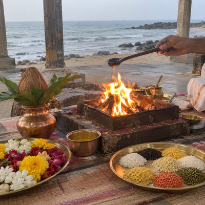Ghee offered into a havan fire beside nine heaps of grain for a Navgraha havan