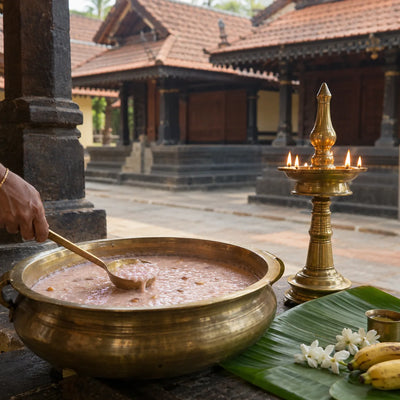 Palpayasam Naivedyam: palpayasam in a bronze uruli beside a brass lamp