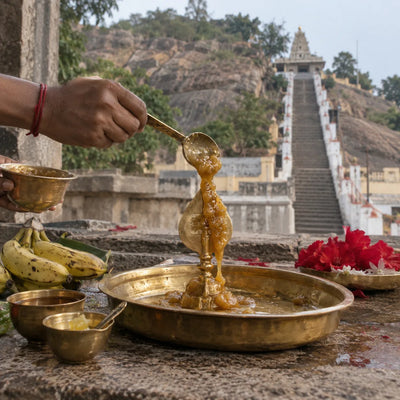 Panchamirtha Abhishekam: panchamirtham poured over a brass vel