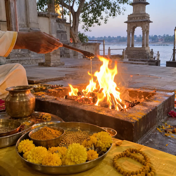 Private havan with yellow offerings and a turmeric mala