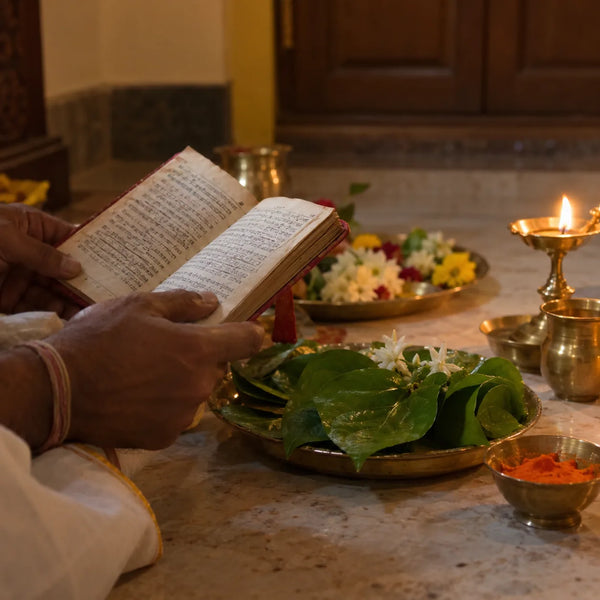 Sundara Kandam Parayanam: an open book, betel-leaf garland and lamp for Sundara Kandam parayanam